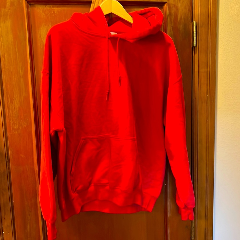 Gildan size large red pullover hoodie with front pocket. 50/50 blend. Cozy.